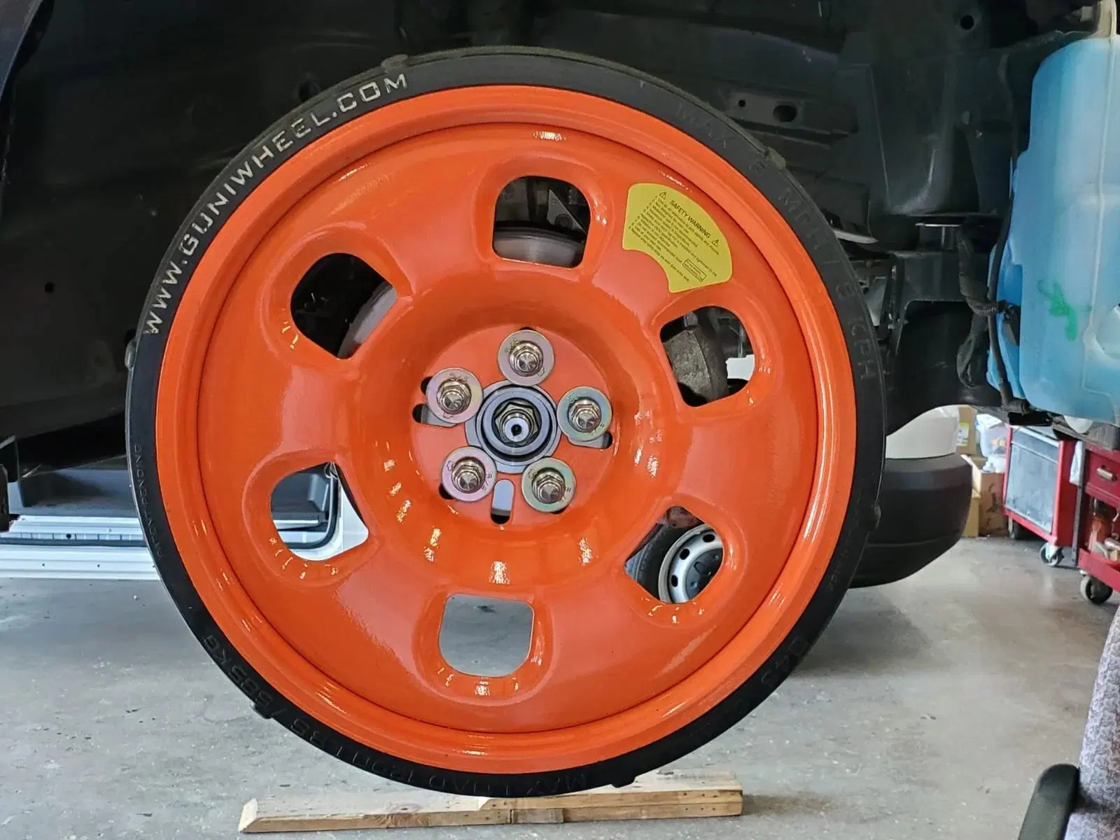 Guniwheel orange universal wheel mounted in workshop